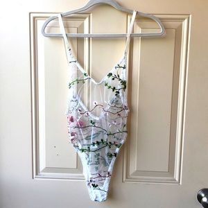 Sheer white floral lingerie bodysuit